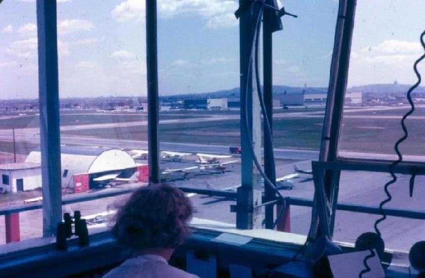 1967 - Looking East over Edna's head, Montreal Flying club in front, and above it, Laurentide Aviation to the left of Canadair Plant 1